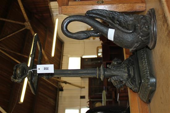 Cast iron swan door stop and a similar stand